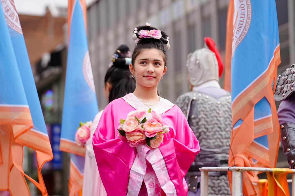 Falun Gong practitioners participate in the Chinese New Year Parade in Flushing, N.Y., on Jan. 21, 2023. (Samira Bouaou/The Epoch Times)