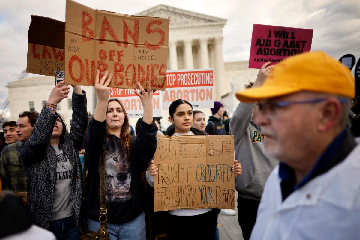 Abortion rights activists protest during the 50th annual March for Life rally in front of the U.S. Supreme Court on Jan. 20, 2023. (Photo by Chip Somodevilla/Getty Images)