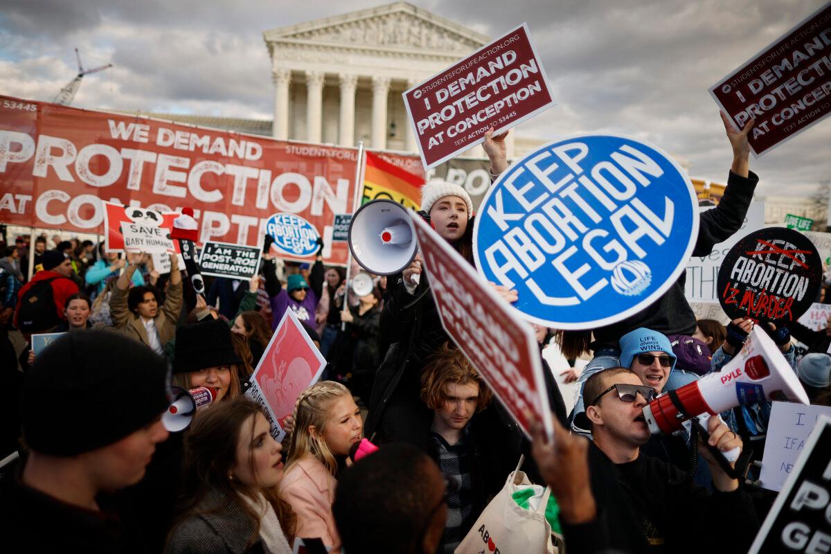 Pro-life and pro-abortion rights activists protest during the 50th annual March for Life rally in front of the U.S. Supreme Court on Jan. 20, 2023. (Chip Somodevilla/Getty Images)
