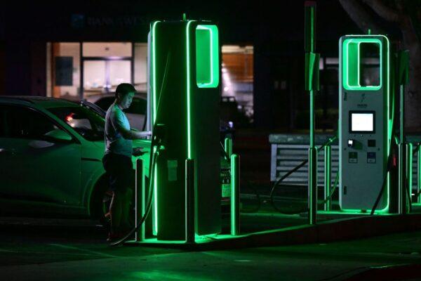 A driver charges his electric vehicle at a charging station as the California Independent System Operator announced a statewide electricity Flex Alert urging conservation to avoid blackouts in Monterey Park, Calif., on Aug. 31, 2022. (Frederic J. Brown/AFP via Getty Images)
