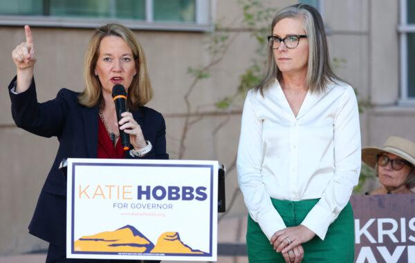 Arizona Secretary of State and Democratic gubernatorial candidate Katie Hobbs (R) looks on as Kris Mayes (L), Democratic candidate for Arizona Attorney General, speaks at a press conference calling for abortion rights in Tucson, Ariz., on Oct. 7, 2022. (Mario Tama/Getty Images)