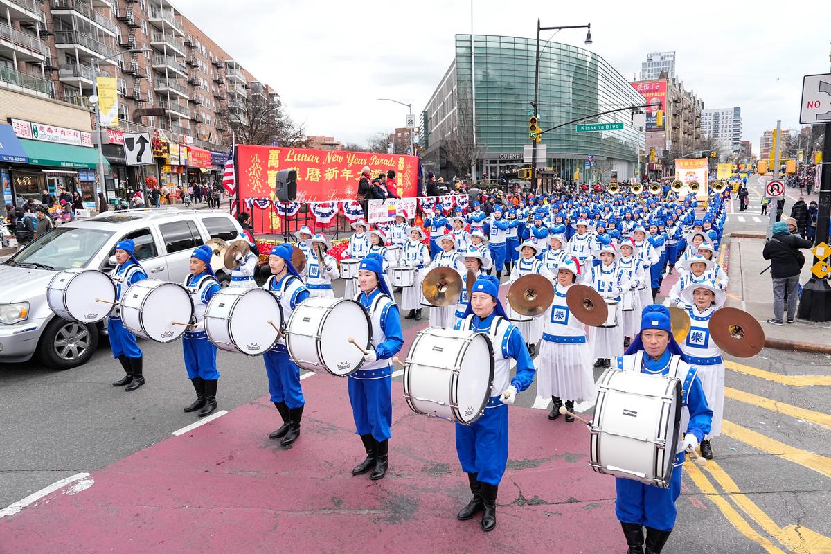 Falun Gong practitioners participate in the Chinese New Year Parade in Flushing, N.Y., on Jan. 21, 2023. (Larry Dye/The Epoch Times)