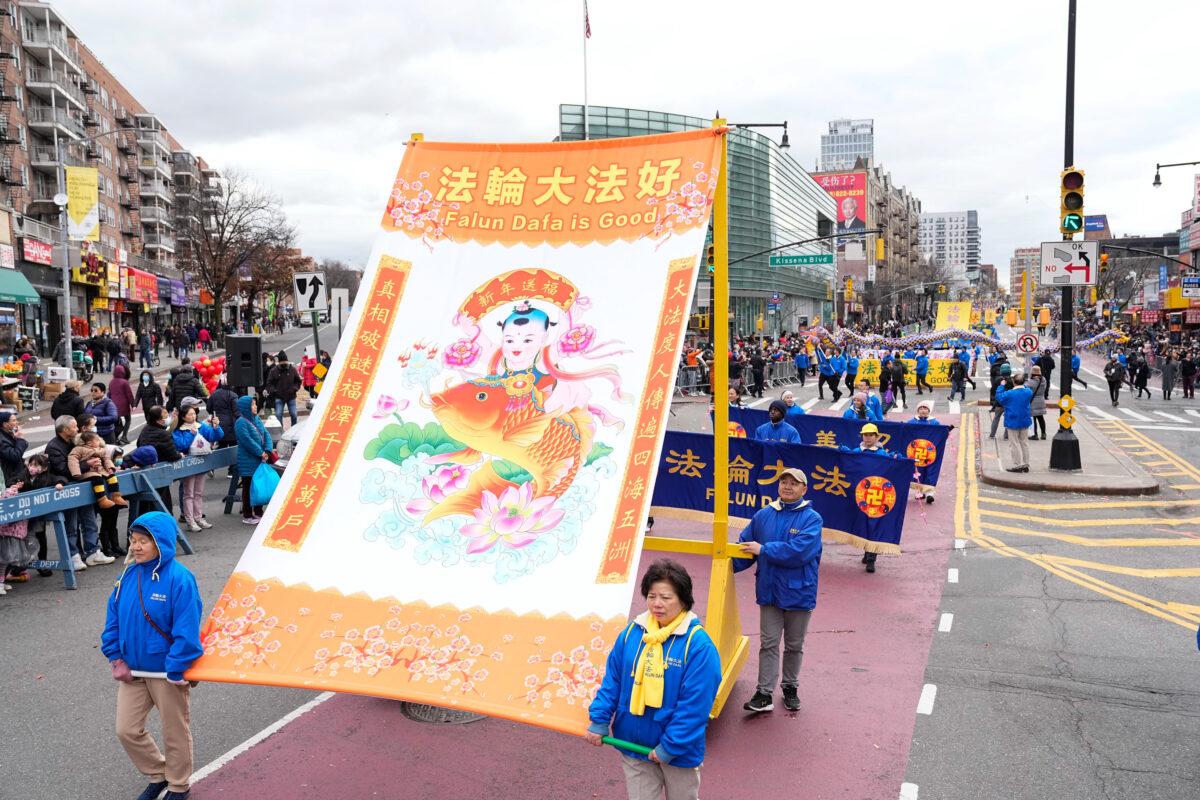 Falun Gong practitioners participate in the Chinese New Year Parade in Flushing, N.Y., on Jan. 21, 2023. (Larry Dye/The Epoch Times)