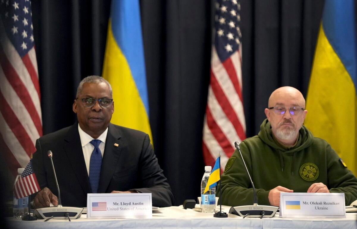 U.S. Defense Secretary Lloyd Austin (L) and the Ukrainian participant Oleksii Reznikov (R) attend the meeting of the 'Ukraine Defense Contact Group' at Ramstein Air Base in Ramstein, Germany, on Jan. 20, 2023. (Michael Probst/AP Photo)