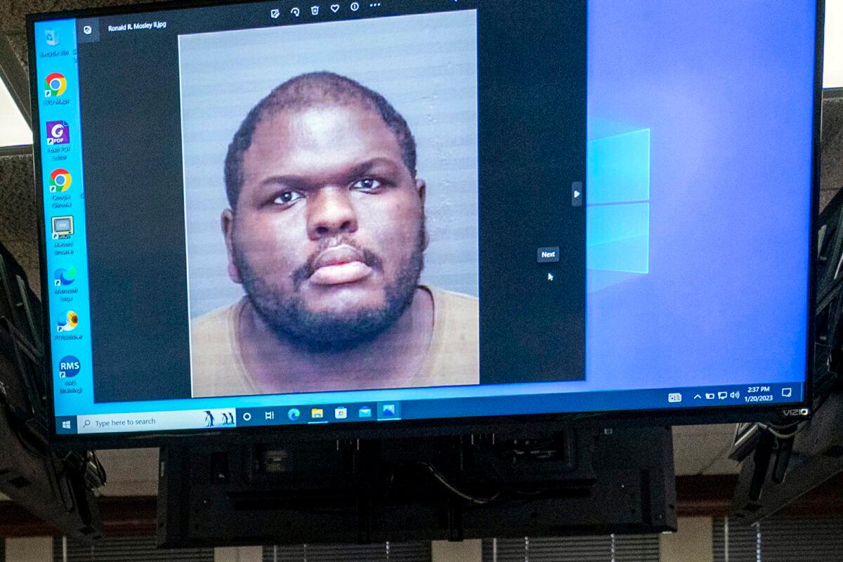 An image of Ronald Ray Mosley II, 25, is displayed on a monitor during a press conference, on Jan. 20, 2023, related to the ongoing investigation of a shooting at the West Side Walmart in Evansville, Ind. (MaCabe Brown/Evansville Courier & Press via AP)