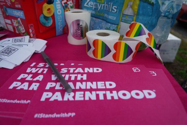 Planned Parenthood passes out free signs, T-shirts, stickers, and water to people attending an abortion rights rally with Vice President Kamala Harris in Tallahassee, Fla., on Jan. 22, 2023. (Courtesy of Natasha Holt)