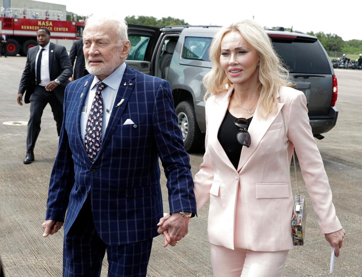 Apollo 11 astronaut Buzz Aldrin (L) and Anca Faur arrive at the Kennedy Space Center for a visit in recognition of the Apollo 11 moon landing anniversary in Cape Canaveral, Fla., on July 20, 2019. (John Raoux/AP Photo)
