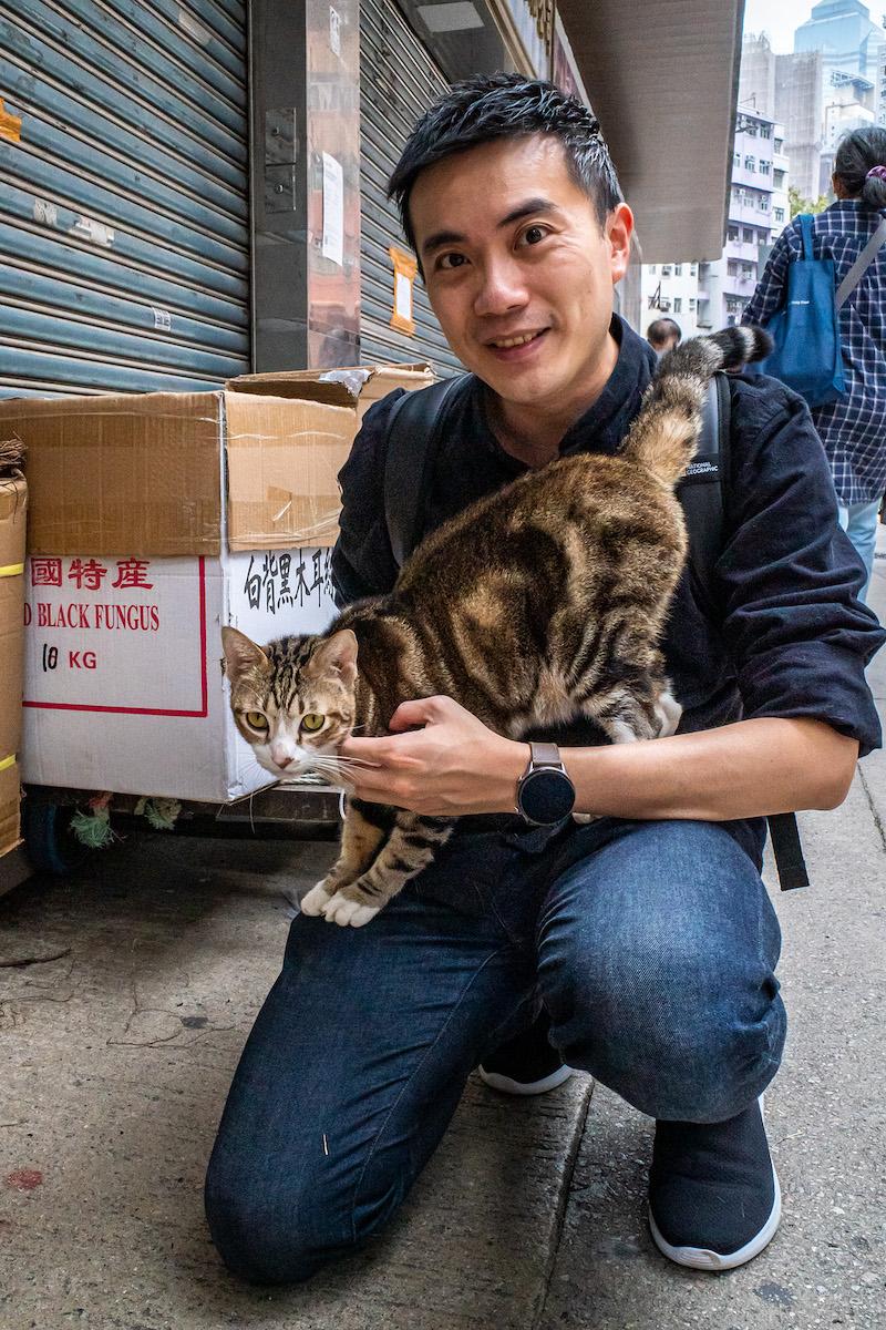 Photographer Jonas Chan likes to shoot photos of street cats and shop cats. This photo highlights the interaction between cats and humans. (Courtesy of Jonas Chan)