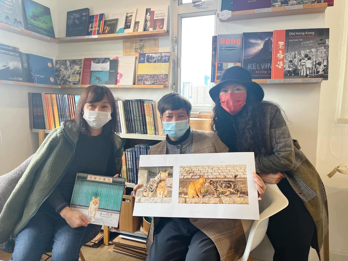 Photobook Part of Us. Published by EASTPRO. Sales of the photobook will support the animals' living and medical expenses. From left to right: EASTPRO Director Josephine Lau, Founder of Tai O Stray Cat Home German Cheung, Part of Us book designer Iris Chan. Dec. 15, 2022. (Facebook of Tai O Stray Cat Home)