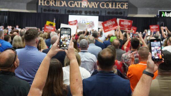 Supporters of Florida Gov. Ron DeSantis, a Republican, try to record his entrance at Florida Gateway College on Nov. 3, 2022. (Nanette Holt/The Epoch Times)