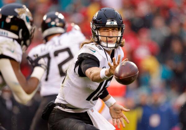 Trevor Lawrence (16) of the Jacksonville Jaguars flicks the ball against the Kansas City Chiefs during the second quarter in the AFC Divisional Playoff game at Arrowhead Stadium in Kansas City on Jan. 21, 2023. (David Eulitt/Getty Images)