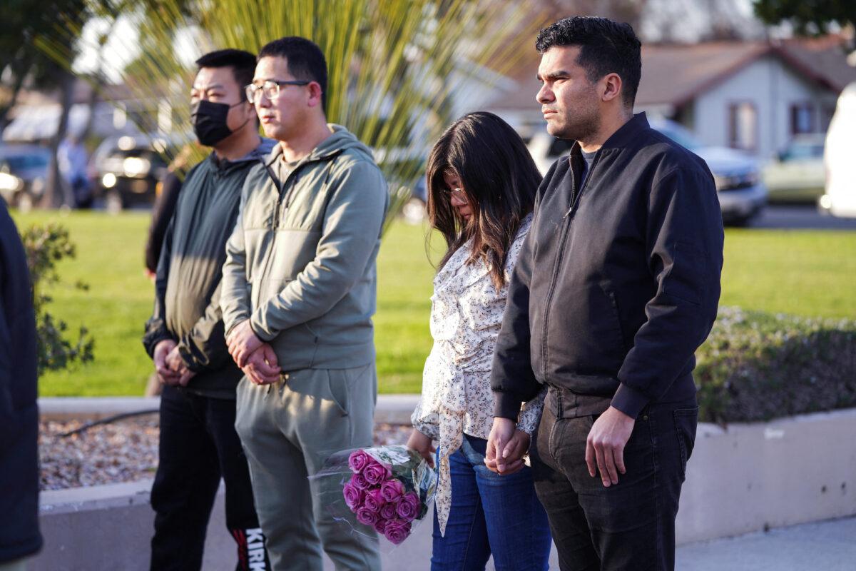 People come together in a prayer as members of the community hold a prayer vigil near the scene of a shooting that took place in Monterey Park, California, on Jan. 22, 2023. (Allison Dinner/Reuters)