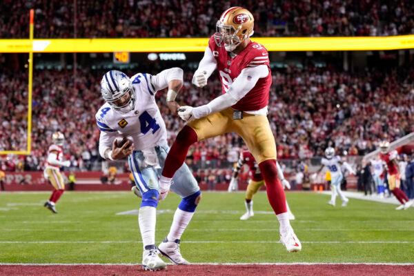 Arik Armstead (91) of the San Francisco 49ers pressures Dak Prescott (4) of the Dallas Cowboys during the fourth quarter of the game in the NFC Divisional Playoff game at Levi's Stadium in Santa Clara, Calif., on Jan. 22, 2023. (Thearon W. Henderson/Getty Images)
