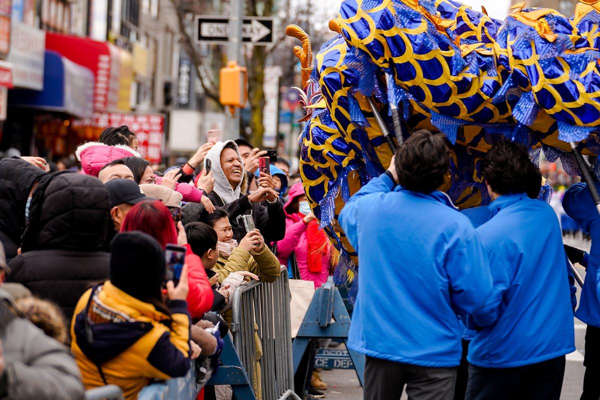 Falun Gong practitioners take part in the Chinese New Year Parade in the Flushing neighborhood of Queens, N.Y., on Jan. 21, 2023. (Samira Bouaou/The Epoch Times)