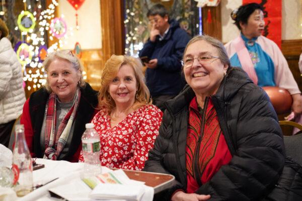 Joanne Casella (R) with her friends at the Chinese New Year celebration event held at the Erie Trackside Manor in Port Jervis, N.Y., on Jan. 22, 2023. (Cara Ding/The Epoch Times)