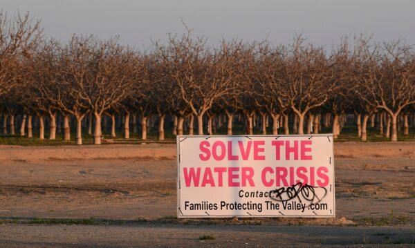A sign calls for solving California's water crisis on the outskirts of Buttonwillow in California's Kern County on April 2, 2021. (Frederic Brown/AFP via Getty Images)