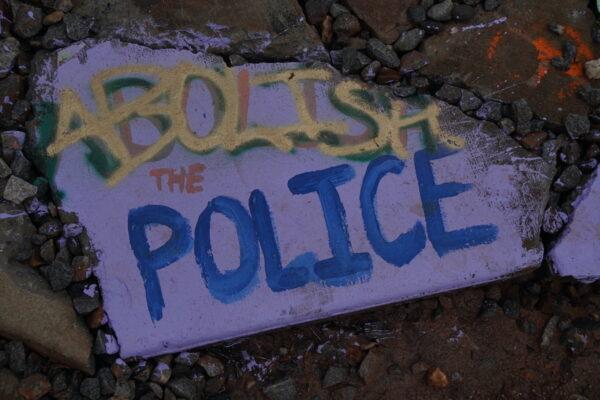 Graffiti reading "Abolish the Police" at an activist camp in the Atlanta Forest, Georgia., on Jan. 23, 2023. (Jackson Elliott/The Epoch Times)