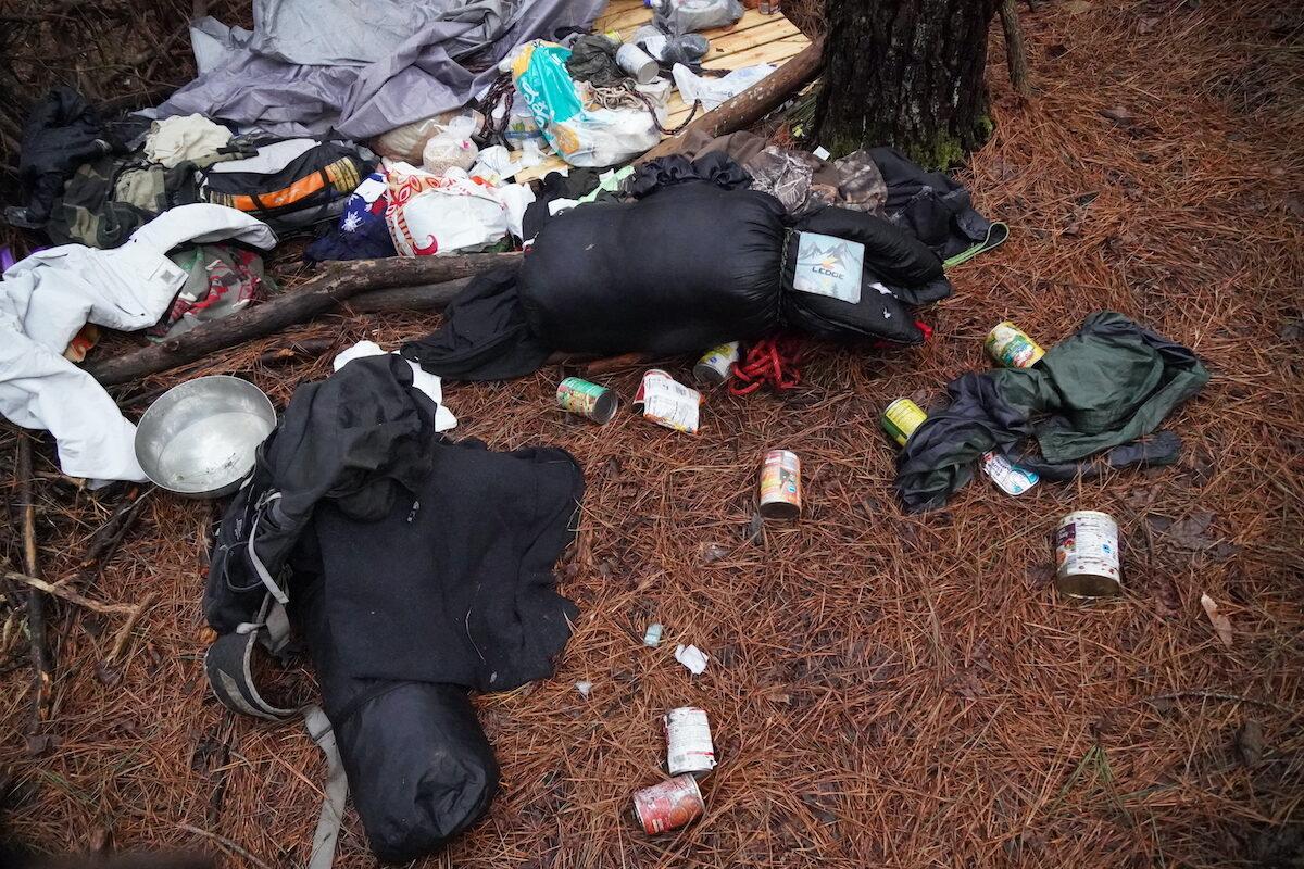 A sleeping bag, clothes, garbage, and other supplies left behind at an activist camp in the Atlanta Forest near Atlanta, Ga. on Jan. 23, 2023. (Jackson Elliott/The Epoch Times)