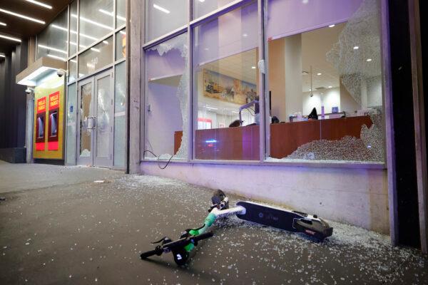 Broken windows at a Wells Fargo branch are seen following a violent protest, in Atlanta, on Jan. 21, 2023. (AP Photo/Alex Slitz)