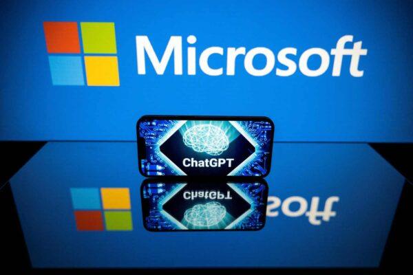 Screens displaying the logos of Microsoft and ChatGPT, a conversational artificial intelligence application software developed by OpenAI. (Lionel Bonaventure/AFP via Getty Images)