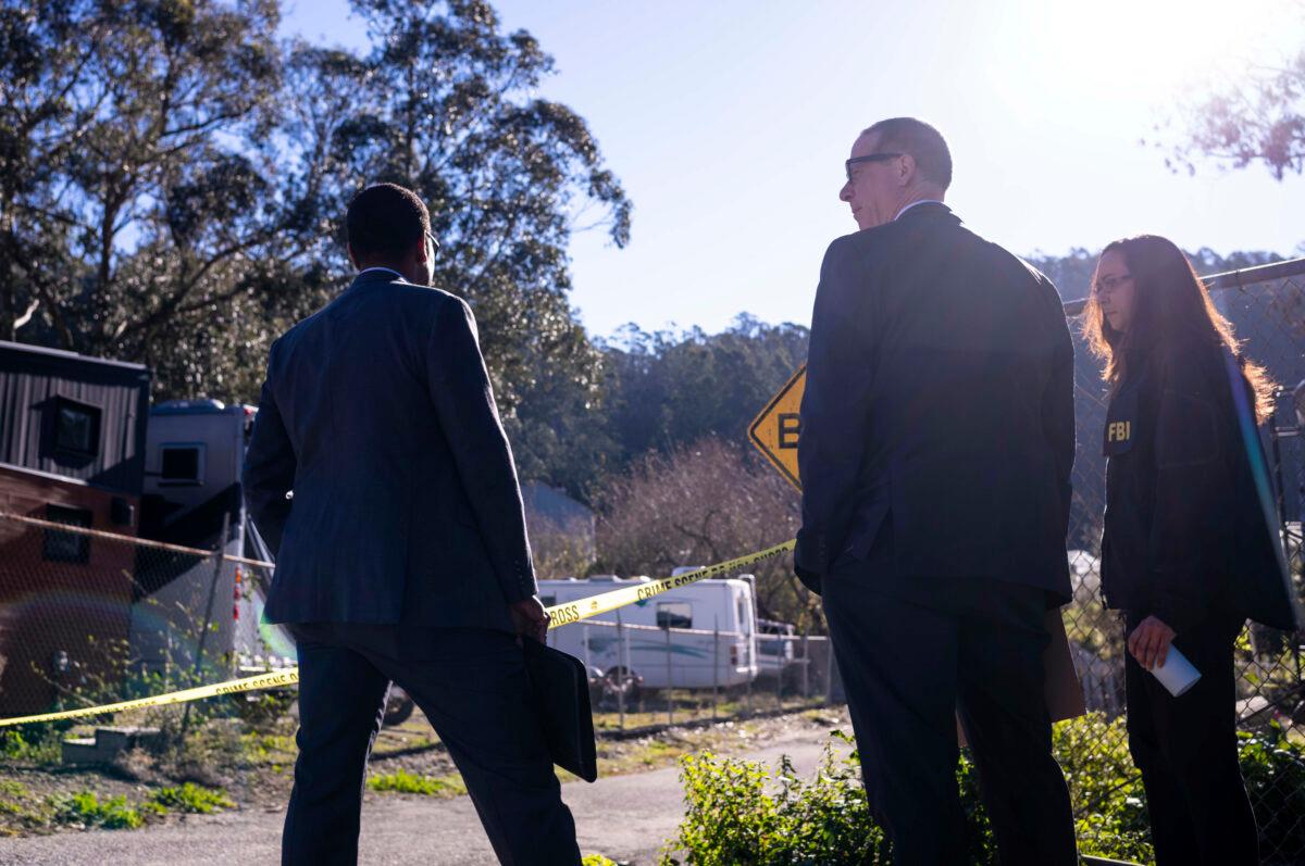 FBI officials gather together before entering the crime scene at Mountain Mushroom Farm in Half Moon Bay, Calif., on Jan. 24, 2023. (Aaron Kehoe/AP Photo)