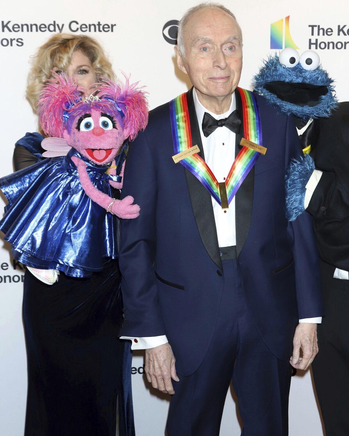 Honoree Lloyd Morrisett appears with muppet characters at the 42nd Annual Kennedy Center Honors at The Kennedy Center in Washington on Dec. 8, 2019. (Greg Allen/Invision/AP)