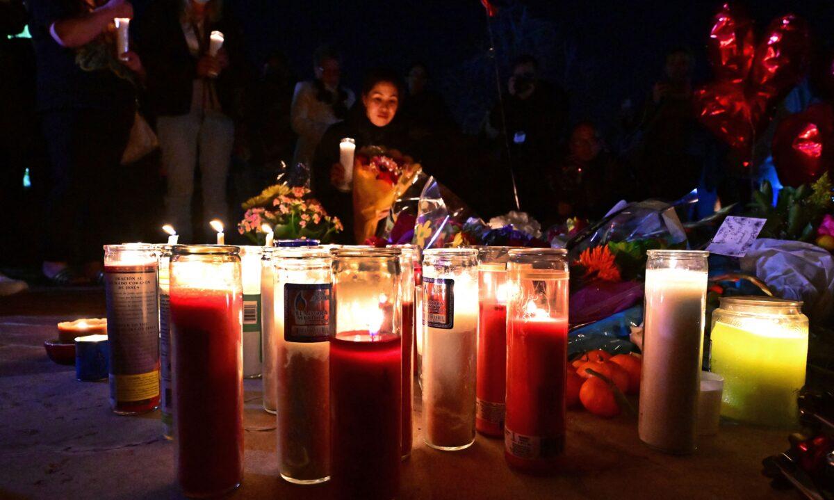 People attend a candlelight vigil for victims of a mass shooting outside the City Hall in Monterey Park, California on Jan. 23, 2023. (Frederic J. Brown/AFP via Getty Images)
