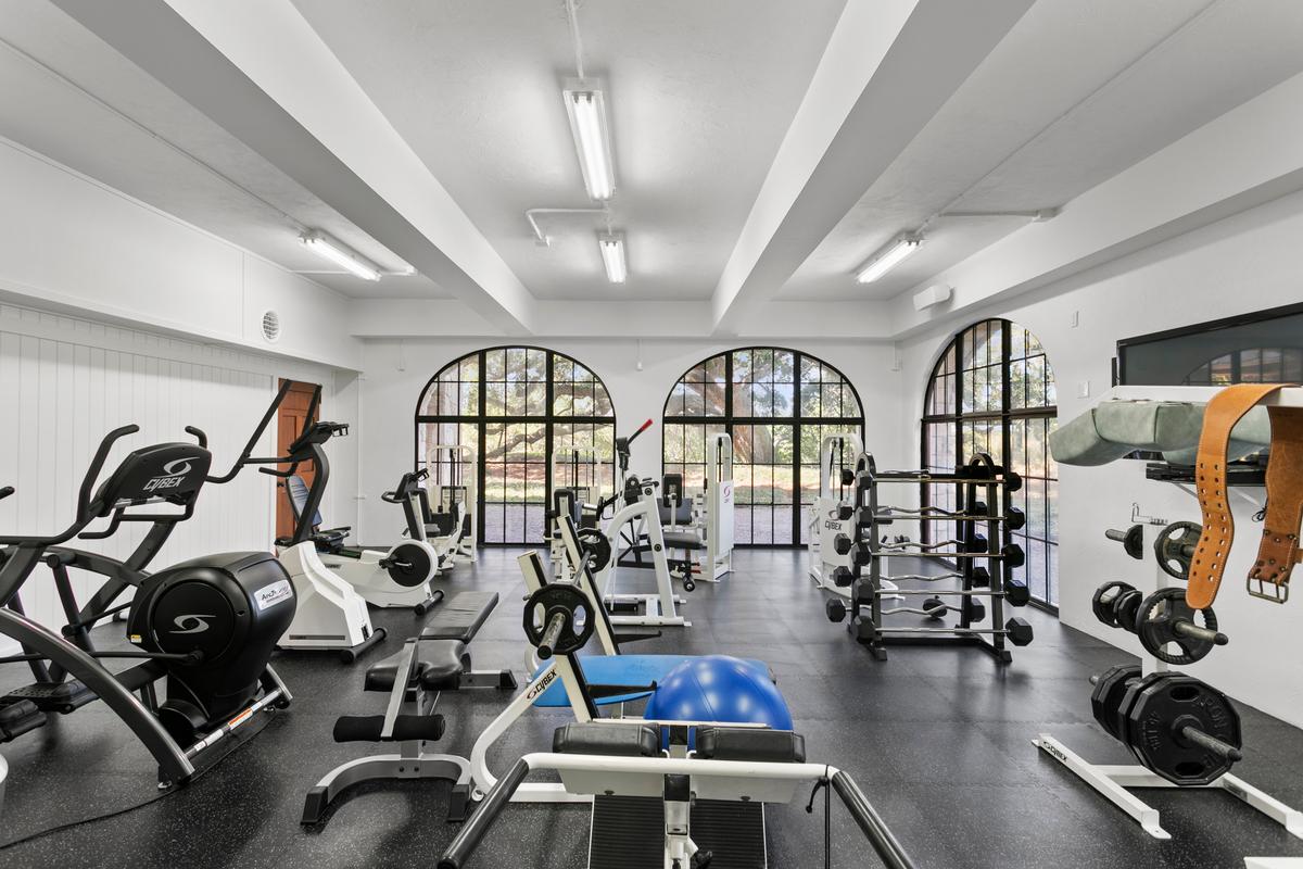 The home’s very large gym is equipped with an impressive array of exercise equipment to allow a comprehensive workout, while enjoying a view off the estate’s landscaped grounds. (Courtesy of Sica Media)