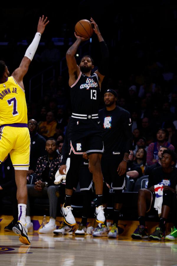 Paul George (13) of the LA Clippers takes a shot against Troy Brown Jr. (7) of the Los Angeles Lakers in the second half in Los Angeles on Jan. 24, 2023. (Ronald Martinez/Getty Images)