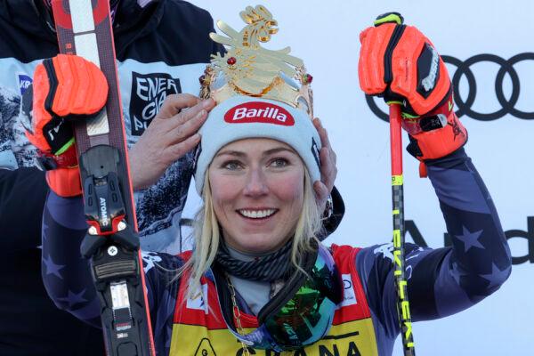 A crown is placed on United States' Mikaela Shiffrin's head after she won an alpine ski, women's World Cup giant slalom, in Kronplatz, Italy, on Jan. 25, 2023. (Alessandro Trovati/AP Photo)