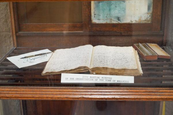 The meeting minutes of the organization of the Town of Wallkill in 1772 were on display at Wallkill town hall in N.Y. on Jan 11, 2023. (Cara Ding/The Epoch Times)