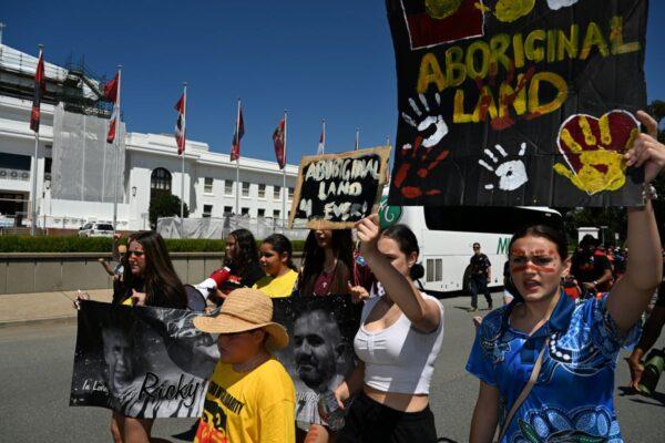 Protesters march past Old Parliament House to the Aboriginal Tent Embassy at part of an “invasion day” rally in Canberra, Thursday, January 26, 2023. (AAP Image/Mick Tsikas)