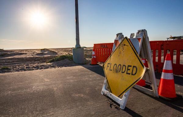 The aftermath of recent storms brought flooding and ocean debris to Bolsa Chica State Beach in Huntington Beach, Calif., on Jan. 25, 2023. (John Fredricks/The Epoch Times)