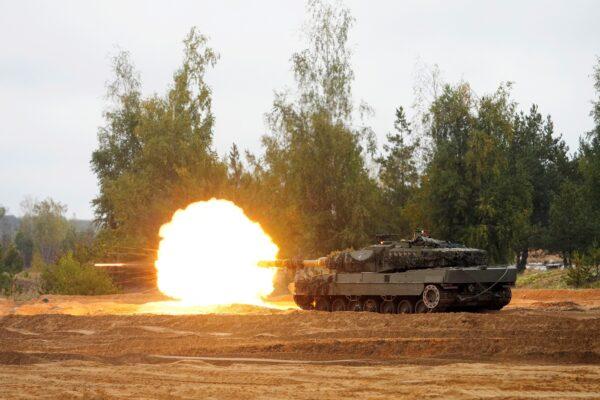 Spanish army tank Leopard 2 of NATO enhanced Forward Presence battle group fires during the final phase of the Silver Arrow 2022 military drill on Adazi military training grounds in Latvia on Sept. 29, 2022. (Ints Kalnins/Reuters)