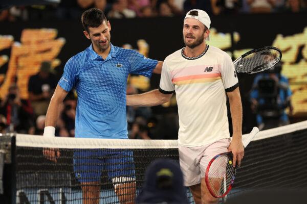 Novak Djokovic of Serbia and Tommy Paul of the United States embrace at the net in the Semifinal singles match against during day 12 of the 2023 Australian Open at Melbourne Park in Melbourne, Australia, on January 27, 2023. (Clive Brunskill/Getty Images)