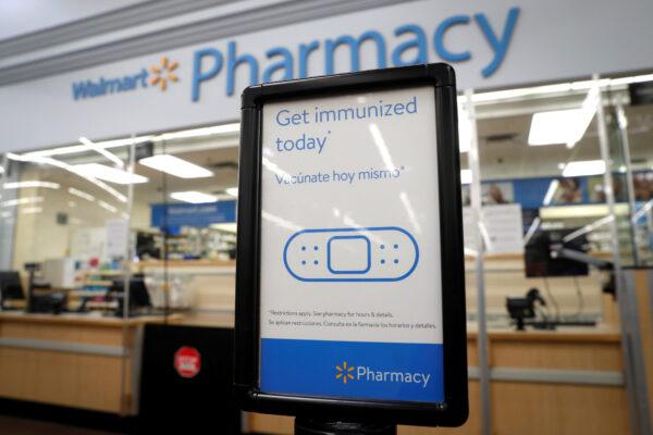 A sign for customers at a pharmacy where the Moderna coronavirus disease (COVID-19) vaccine is available inside a Walmart department store as Walmart and other major U.S. pharmacies take part in the Federal Retail Pharmacy Program to increase vaccinations in the U.S. in West Haven, Conn., on Feb. 17, 2021. (Mike Segar/Reuters)