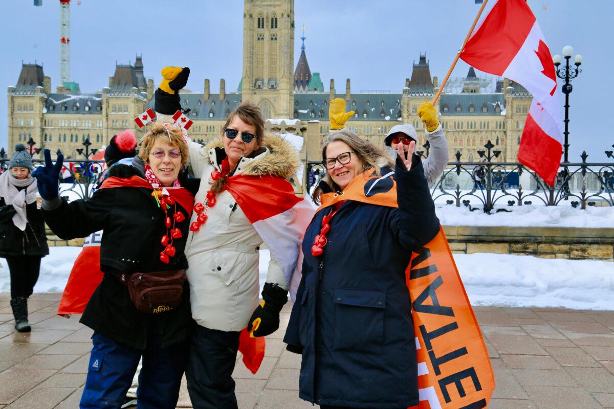 Friends attend the celebration to mark the first anniversary of the Freedom Convoy protest in Ottawa on Jan. 28, 2023. (The Epoch Times/Jonathan Ren)