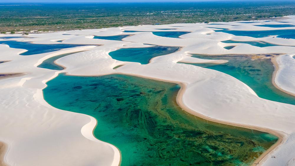 Perennial lagoons, caused by rains during the wet season, appear amid sand dunes in Lençóis Maranhenses. (guilhermespengler/Shutterstock)