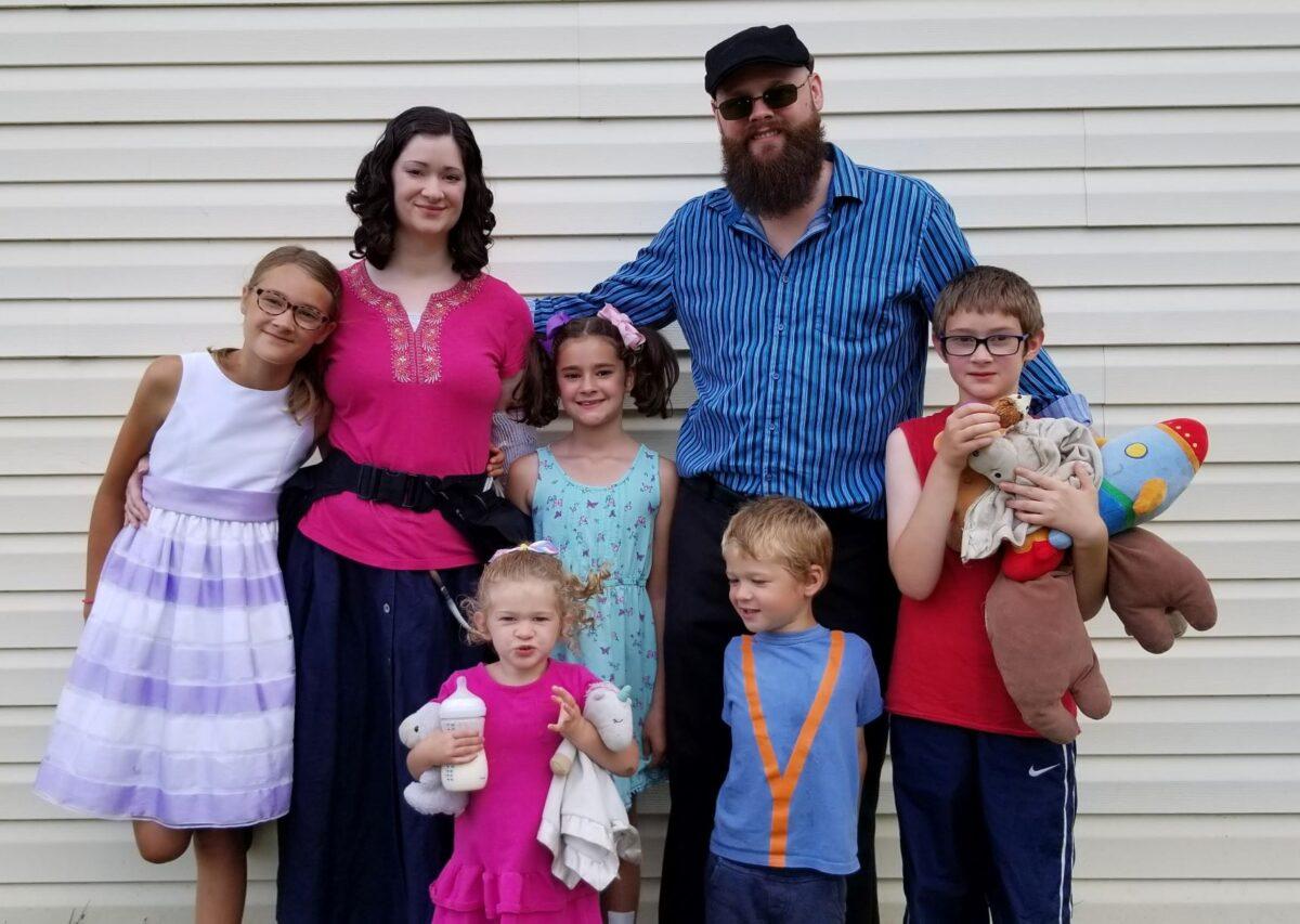 Katie Shier, pictured with her husband Ron and their children, was denied a heart transplant by the University of Michigan for refusing to get the COVID vaccine. (Imaged supplied by the Shier family)