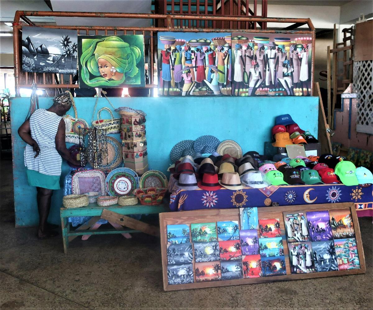 A shopper examines merchandise at the Castries Market in St. Lucia. (Courtesy of Victor Block)