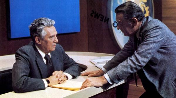 Max Schumacher (William Holden, R) looking after his emotionally compromised friend Howard Beale (Peter Finch), in “Network.” (Metro-Goldwyn-Mayer)