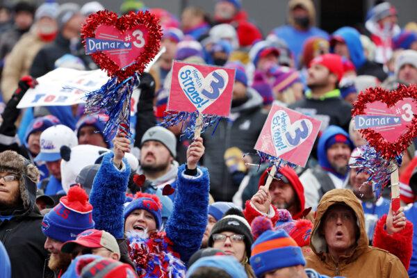  Fans hold signs in support of Buffalo Bills safety Damar Hamlin during a game against the New England Patriots at Highmark Stadium in Orchard Park, N.Y., on Jan. 8, 2023. (Timothy T Ludwig/Getty Images)