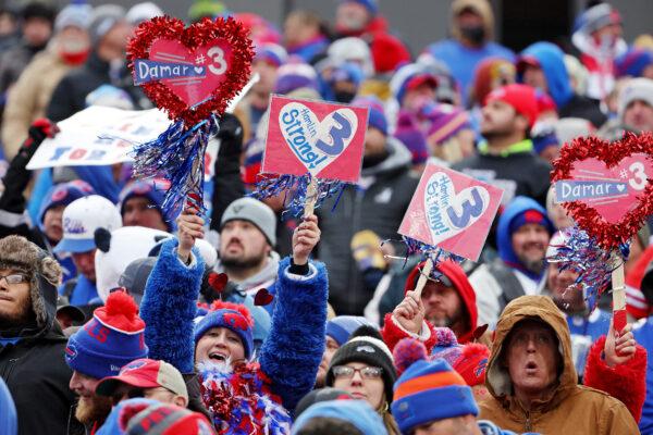 Fans hold signs in support of Buffalo Bills safety Damar Hamlin during a game against the New England Patriots at Highmark Stadium in Orchard Park, N.Y., on Jan. 8, 2023. (Timothy T Ludwig/Getty Images)