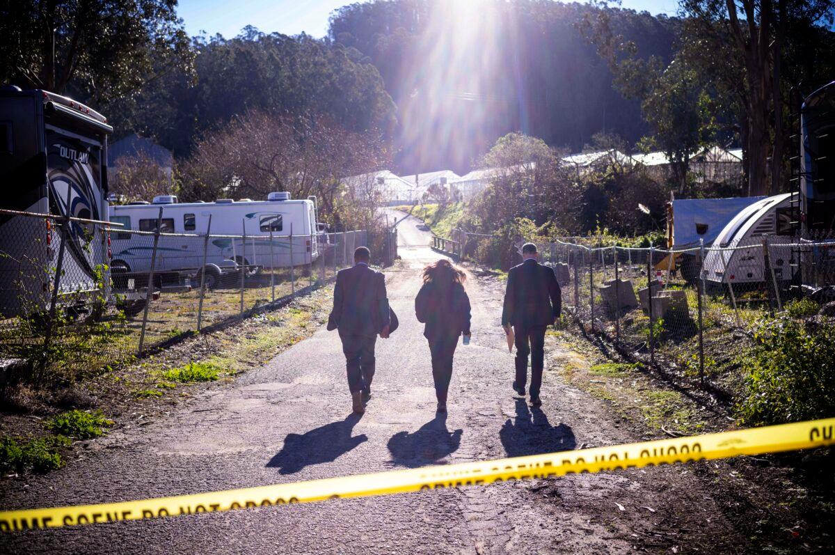 FBI officials walk towards the crime scene at Mountain Mushroom Farm in Half Moon Bay, Calif., on Jan. 24, 2023. (Aaron Kehoe/AP Photo)