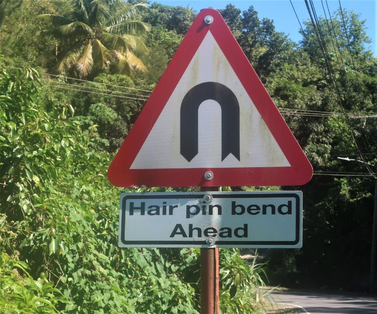 Signs warning of hairpin turns are frequent on roads in St. Lucia. (Courtesy of Victor Block)