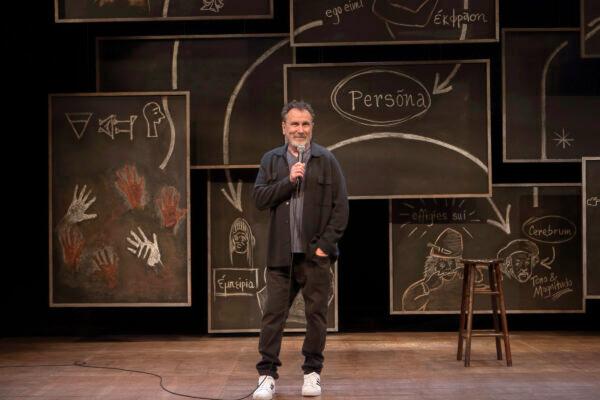 The set of "Colin Quinn: Small Talk" is a simple stage with a backdrop of pictures. (Monique Carboni)