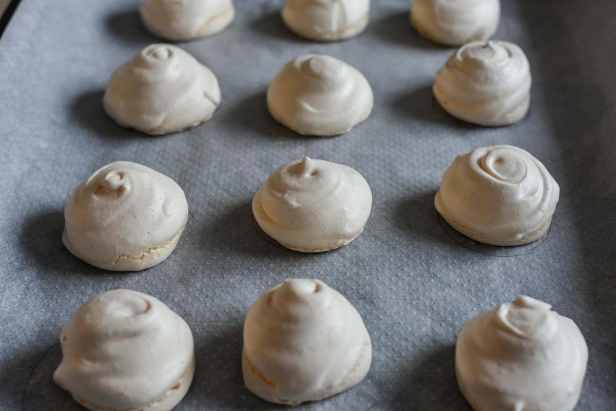 Bake the meringues until they are dry and peel off easily from the parchment paper. (Audrey Le Goff)