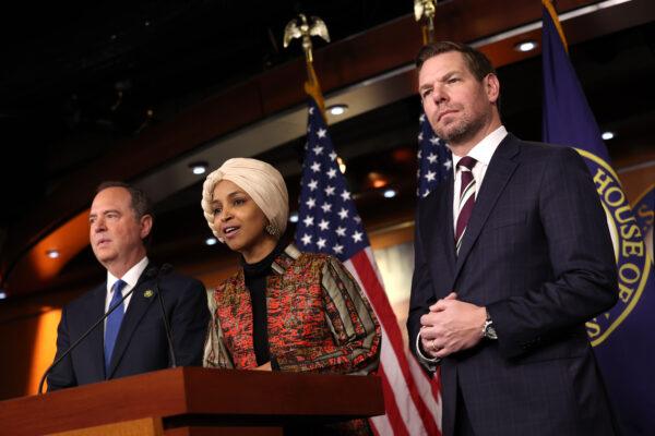  Rep. Ilhan Omar (D-Minn.) (C), joined by Reps. Adam Schiff (D-Calif.) (L) and Eric Swalwell (D-Calif.) (R), speaks at a press conference at the U.S. Capitol Building in Washington on Jan. 25, 2023. (Kevin Dietsch/Getty Images)