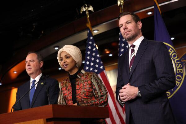 Rep. Ilhan Omar (D-Minn.) (C), joined by Reps. Adam Schiff (D-Calif.) (L) and Eric Swalwell (D-Calif.) (R), speaks at a press conference at the U.S. Capitol Building in Washington on Jan. 25, 2023. (Kevin Dietsch/Getty Images)