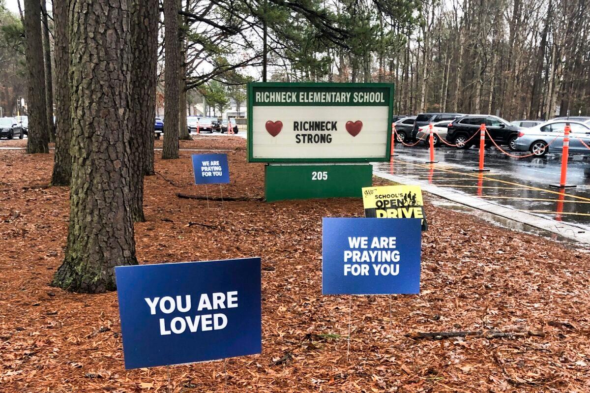 Signs stand outside Richneck Elementary School in Newport News, Va., on Jan. 25, 2023. (Denise Lavoie/AP Photo)